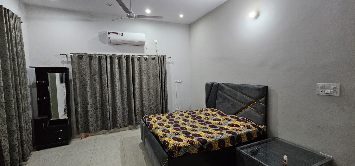 AC room interior at Four Points Resort homestay