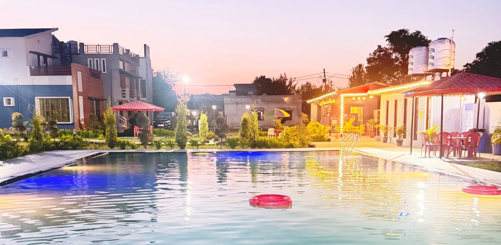 Luxury swimming pool with night lighting in Dehradun resort