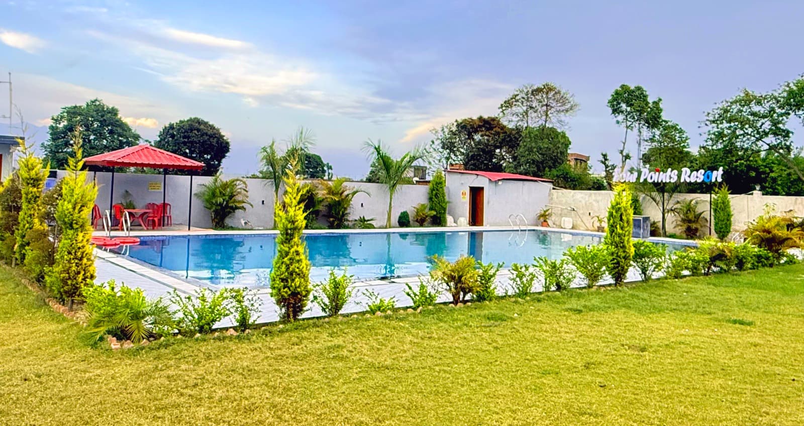 Clean and spacious swimming pool with garden area in Dehradun